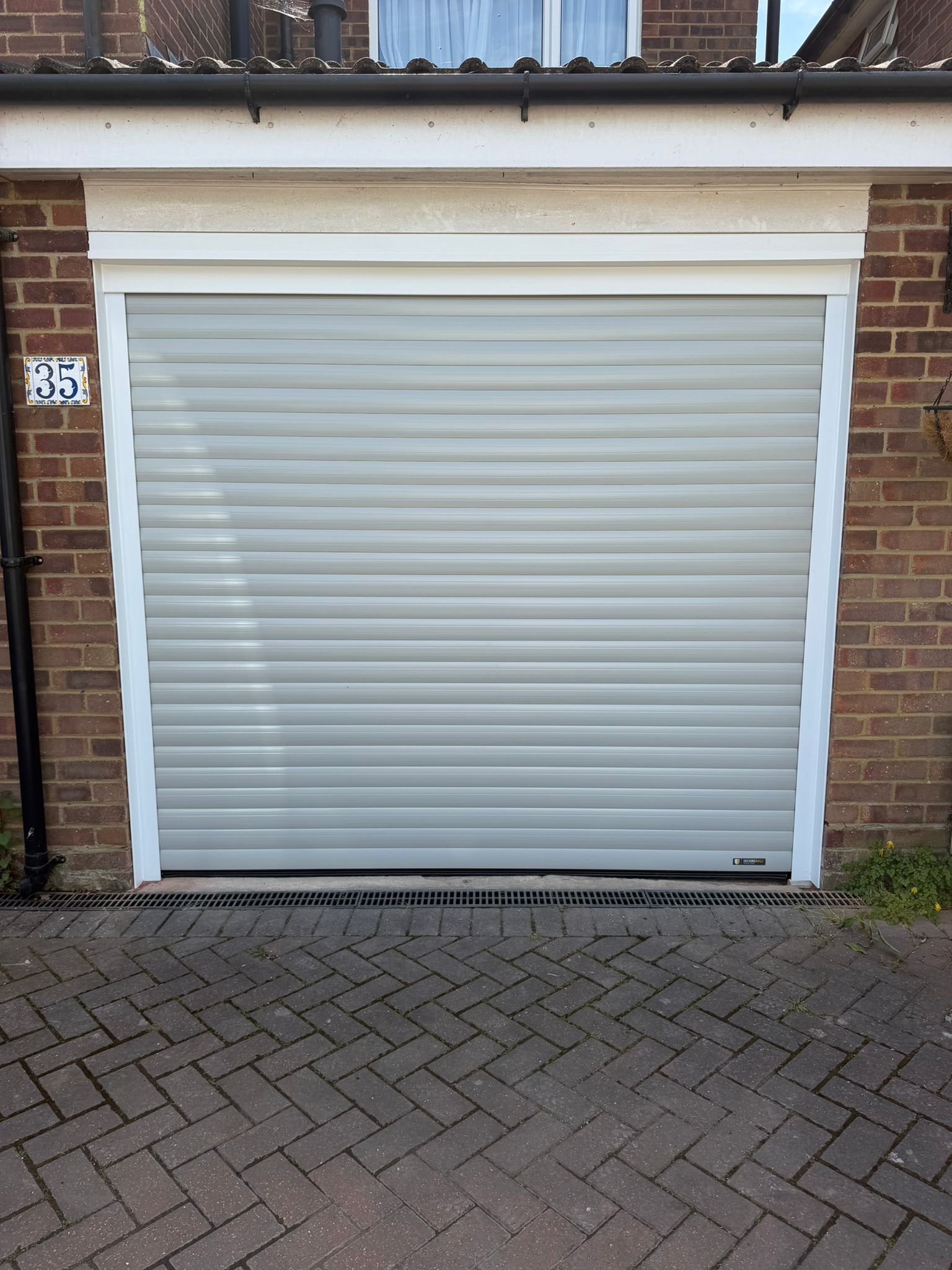 Manor Garage Doors fits a new Alurol 77 Secured by desgin roller door in Ware .  