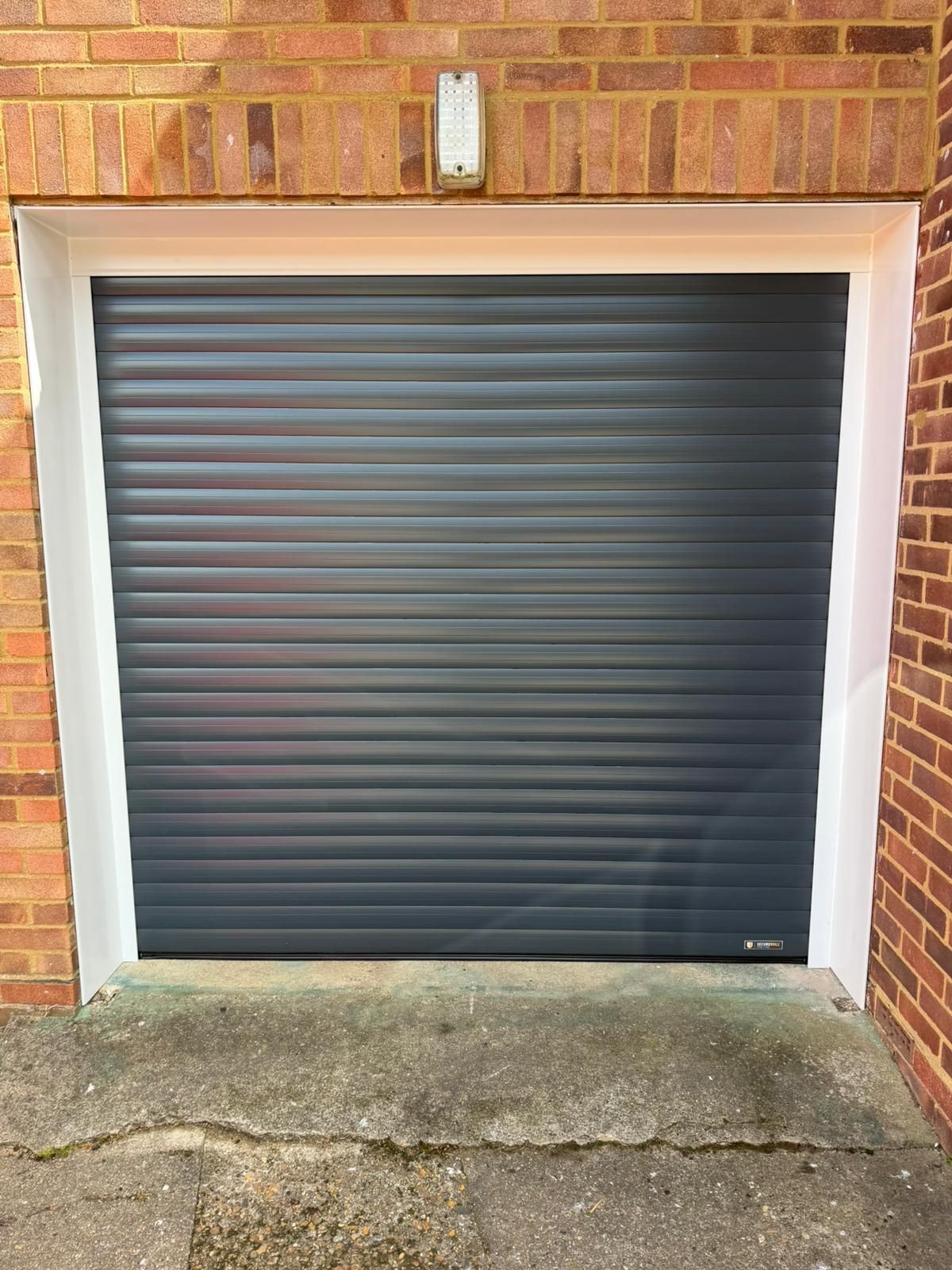 Manor garage doors replace it with a New Alurol roller garage door with full saftey system and remote control in Hertford . 