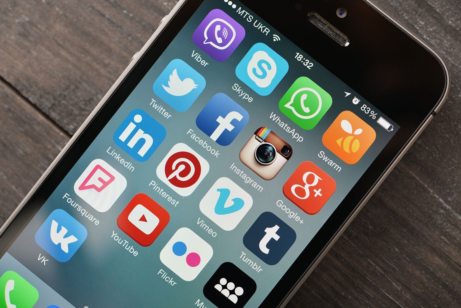 social media marketing agency in Buckinghamshire - Social media icons on screen of smartphone