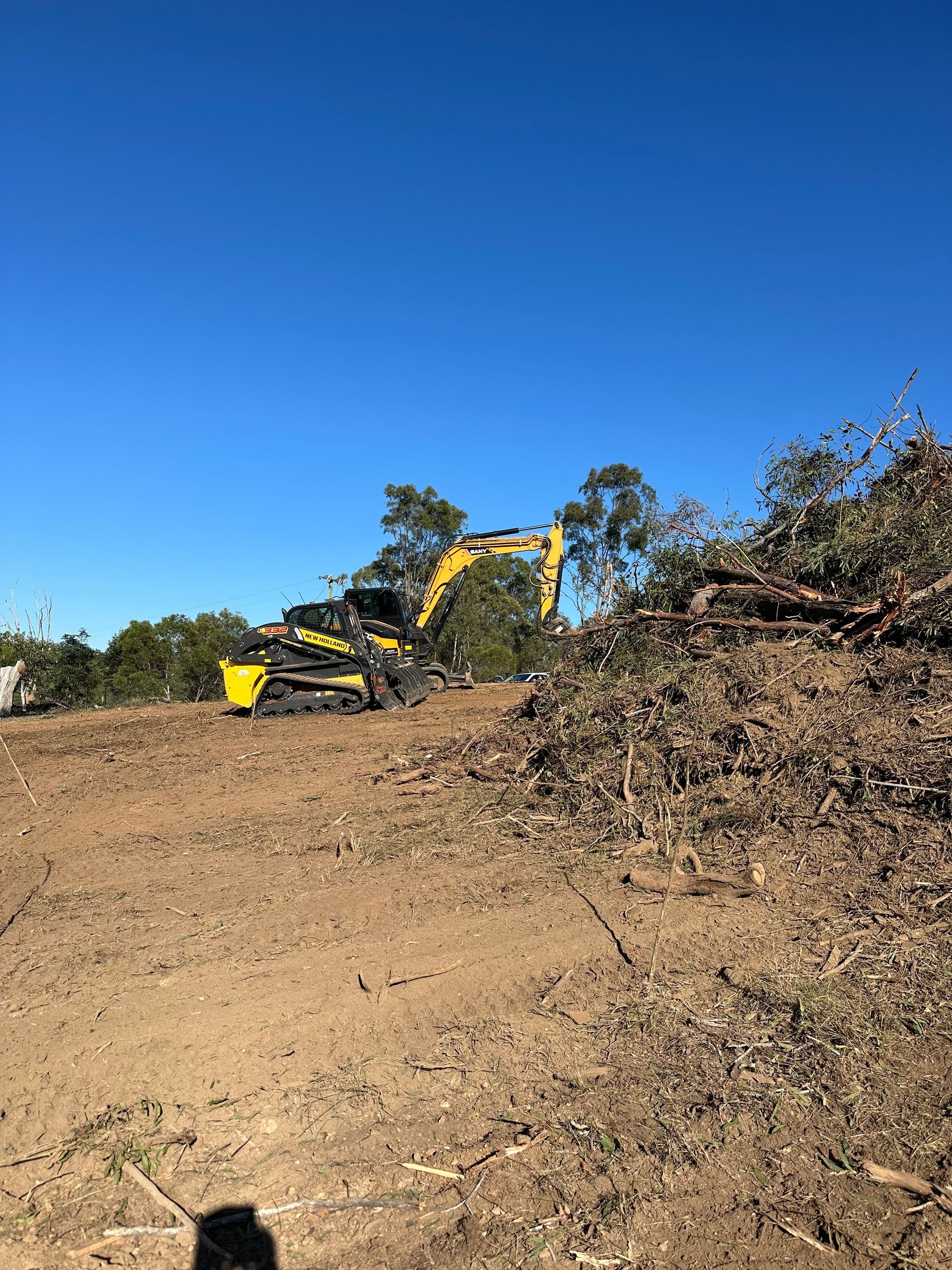 A Couple of Metal Pipes Sitting on Top of a Metal Tray — A1 Tree Service in Childers, QLD