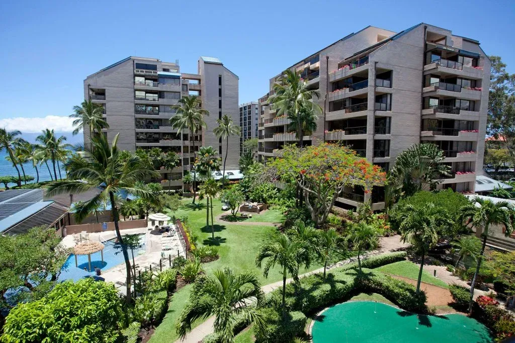 a large building with a pool in the middle of it