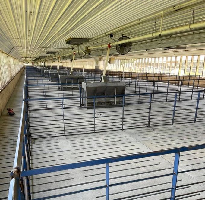 A large building with a lot of feeders and fans