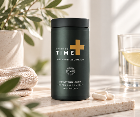 Green NAD+ supplement bottle labeled “TIME+” on a stone tray beside a glass of water in soft sunlight