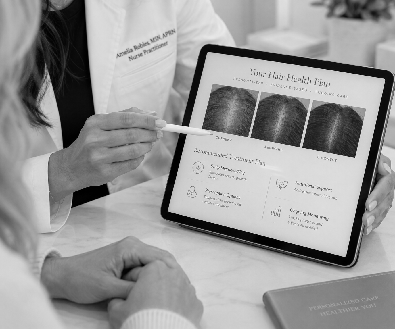 Nurse practitioner showing tablet with information on hair restoration treatment options