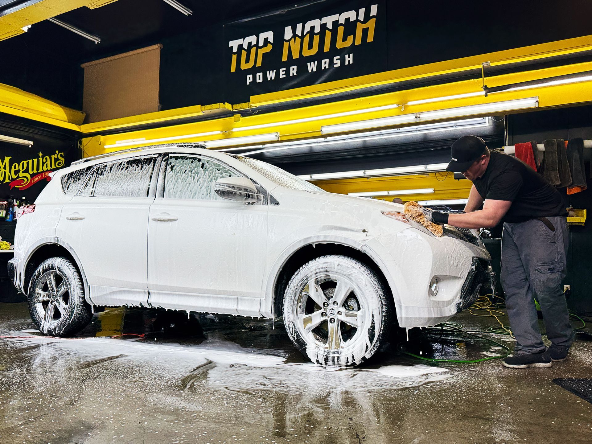 A car that has been covered in soap and water