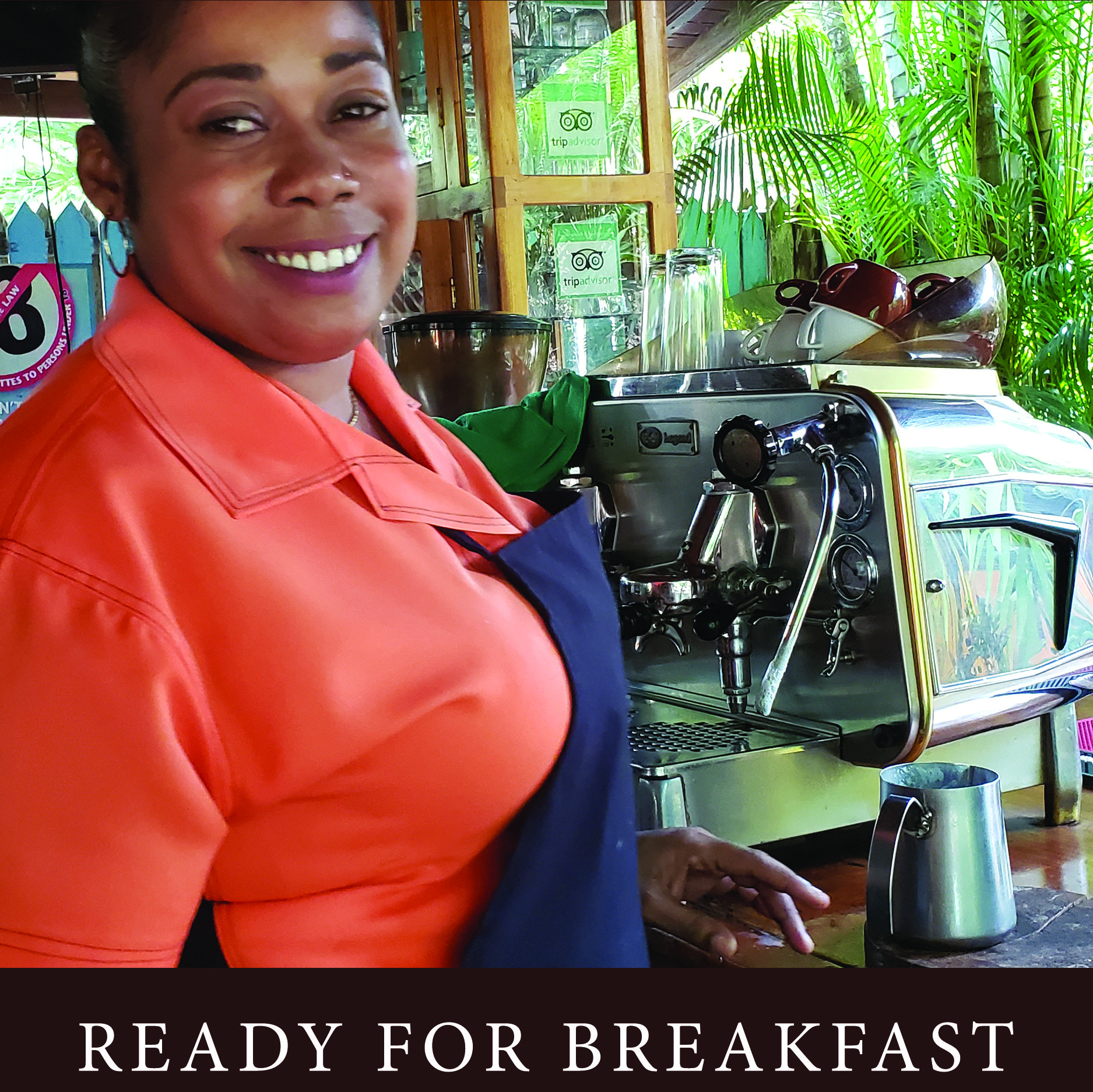 Woman in orange shirt and blue apron, smiling, operating an espresso machine, 
