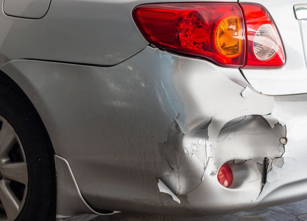 Picture of dent on back of car after a car accident