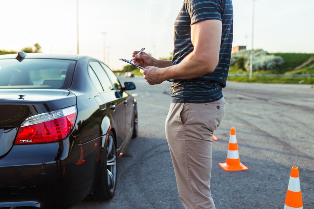 Driving Instructor Taking Notes — Reliable Driver Training in Darwin, NT