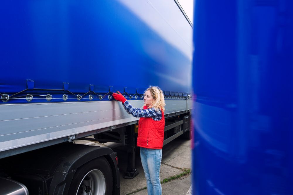 Woman Checking Truck — Reliable Driver Training in Darwin, NT