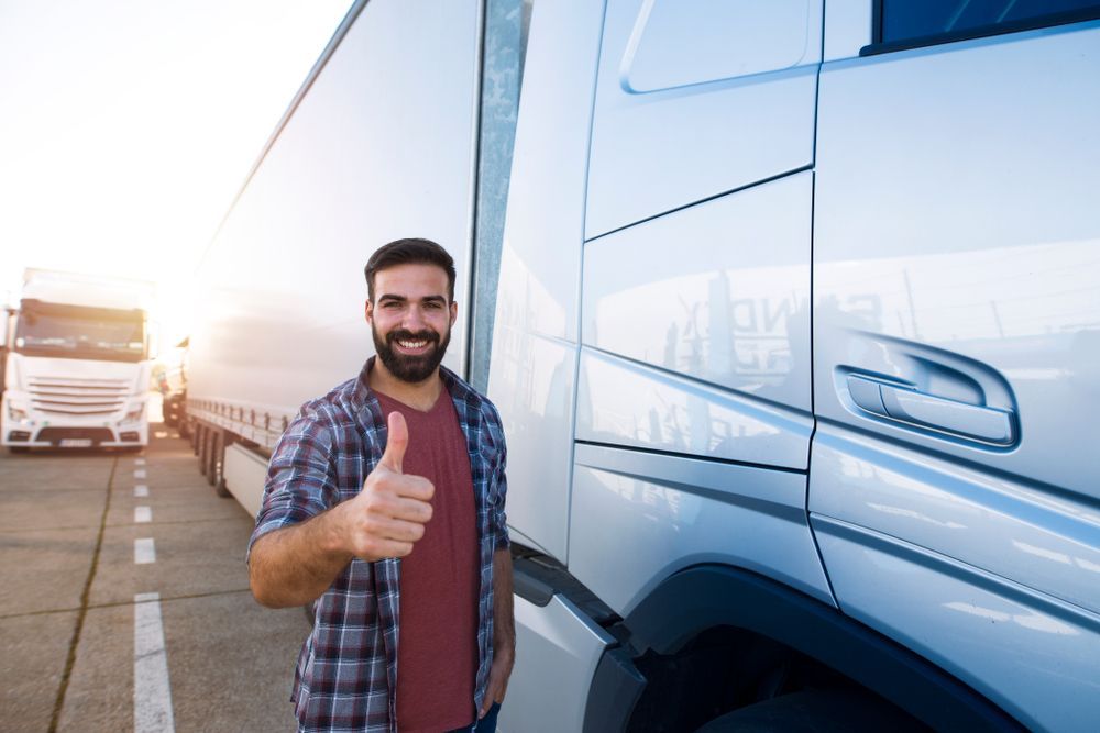 Truck Driver Standing Next To Truck — Reliable Driver Training in Darwin, NT