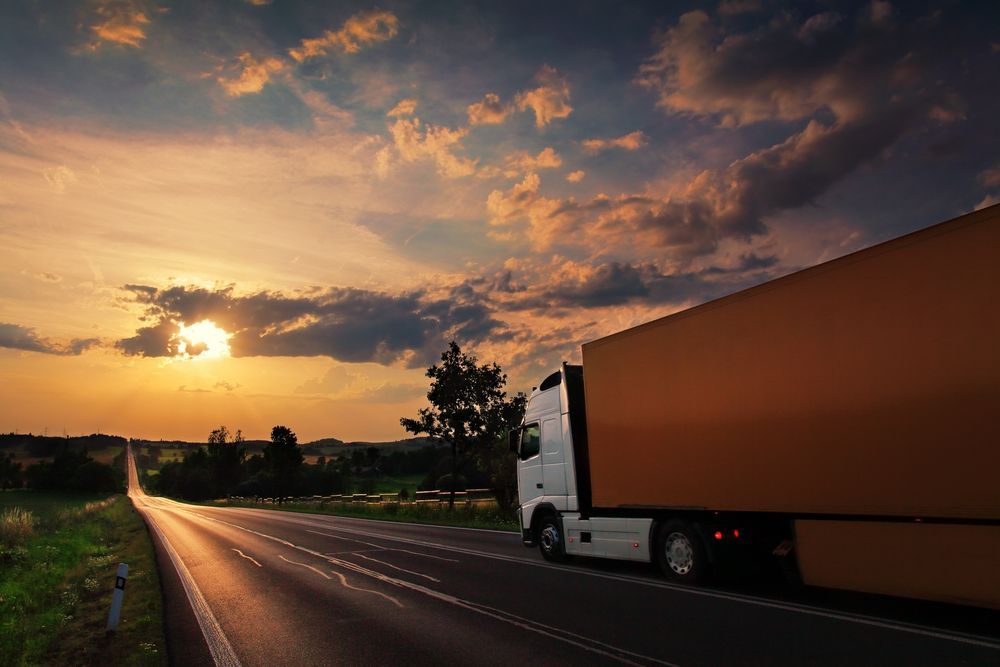 Truck Driving At Dusk — Reliable Driver Training in Darwin, NT