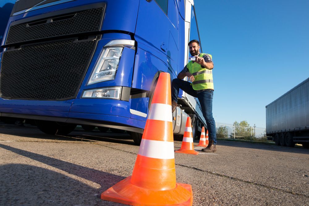 Truck Driver Leaning On Truck — Reliable Driver Training in Darwin, NT