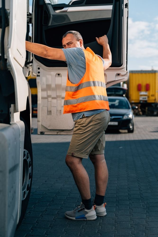 Driver Getting Into Truck — Reliable Driver Training in Darwin, NT