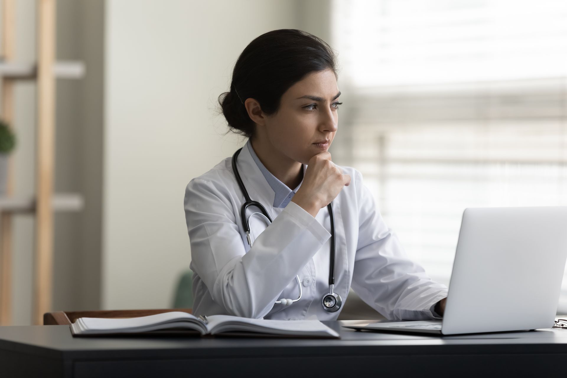 doctor looking at a computer