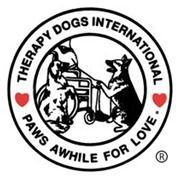 Therapy Dogs International logo with a dog greeting a person in a wheelchair, surrounded by red hearts.