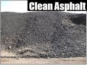 Large pile of dark gravel labeled “Clean Asphalt” beside a road