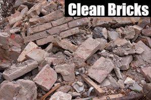 Pile of broken bricks and rubble with the words “Clean Bricks” overlaid at the top.