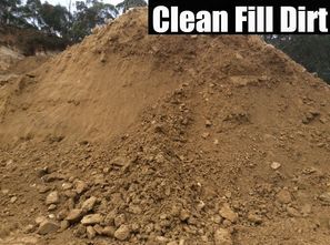 Large dirt pile with “Clean Fill Dirt” text at the top