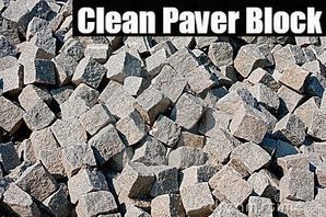 Pile of gray paver blocks with “Clean Paver Block” text overlay