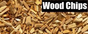 Pile of wood chips with the label “Wood Chips” in bold white text on a black banner.