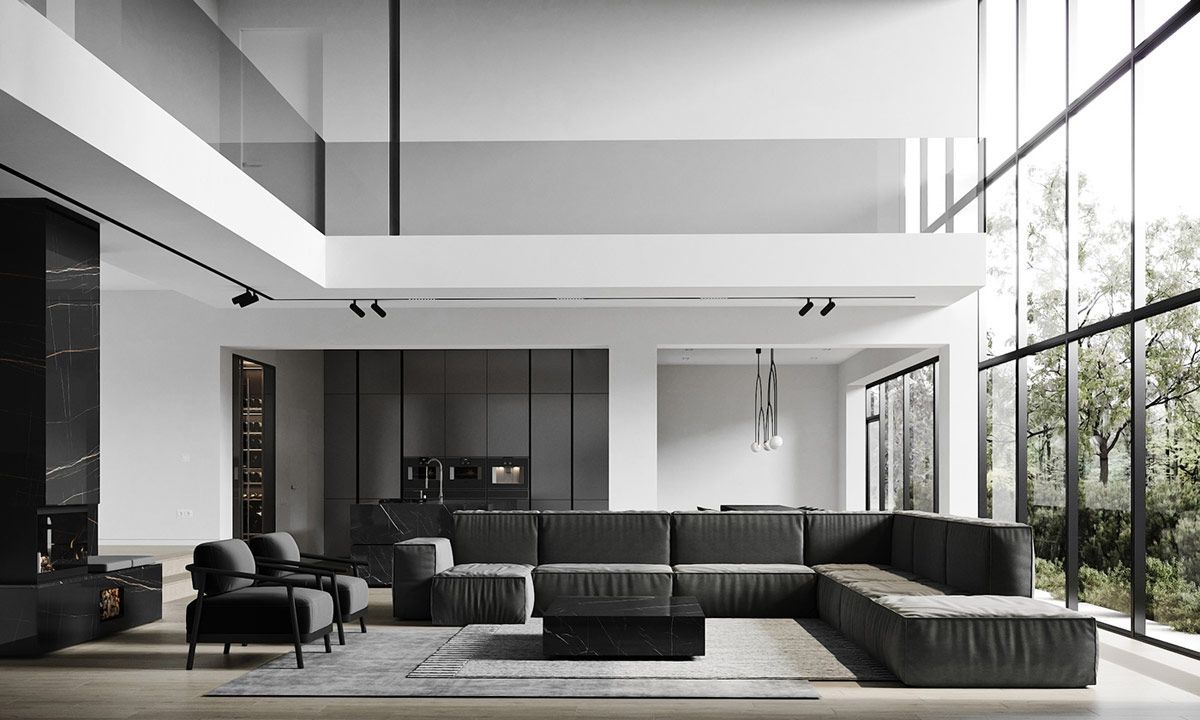 Moderne open woonkamer met zwarte banken, ramen van vloer tot plafond en minimalistische inrichting.