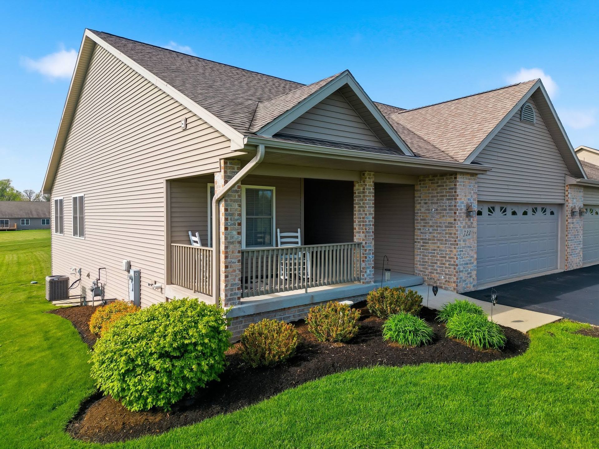Single-story home with a covered porch and landscaped front lawn