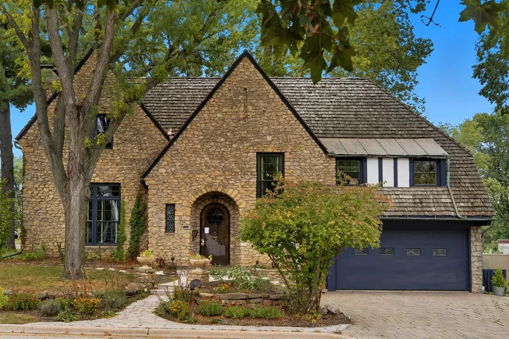 Stone home exterior photographed by Frank Photos LLC
