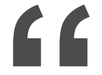 A pair of gray quotation marks on a white background.