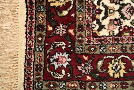 A Person Is Cleaning a Rug with A Broom | Sheboygan, WI | Hoffman's Cleaners LLC
