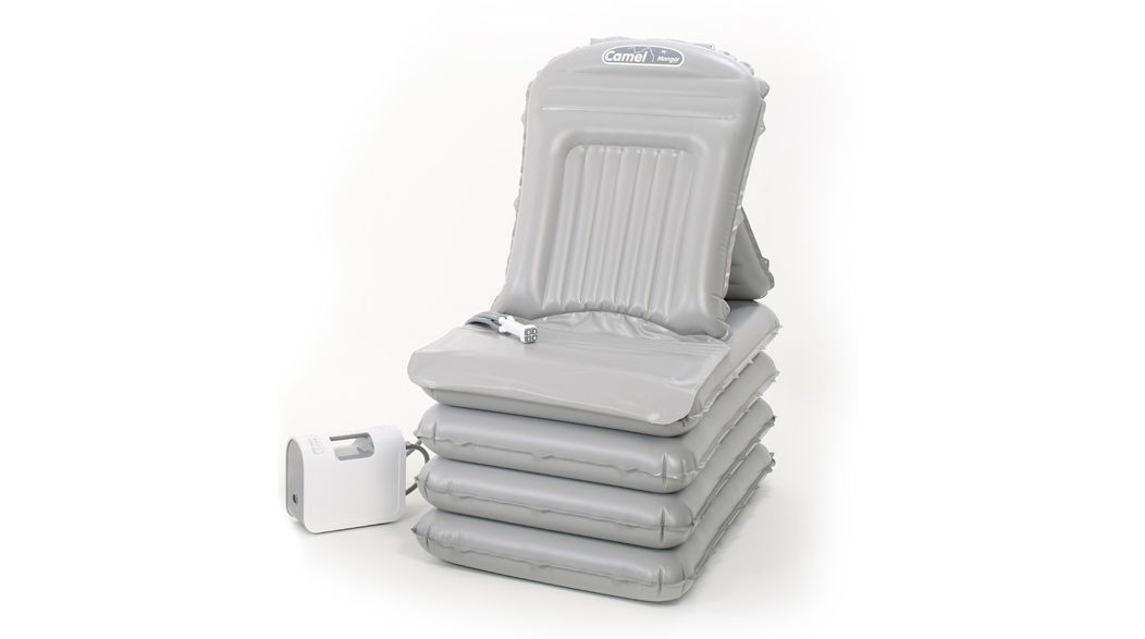 Stack of gray ultrasound transducers with a small white device.