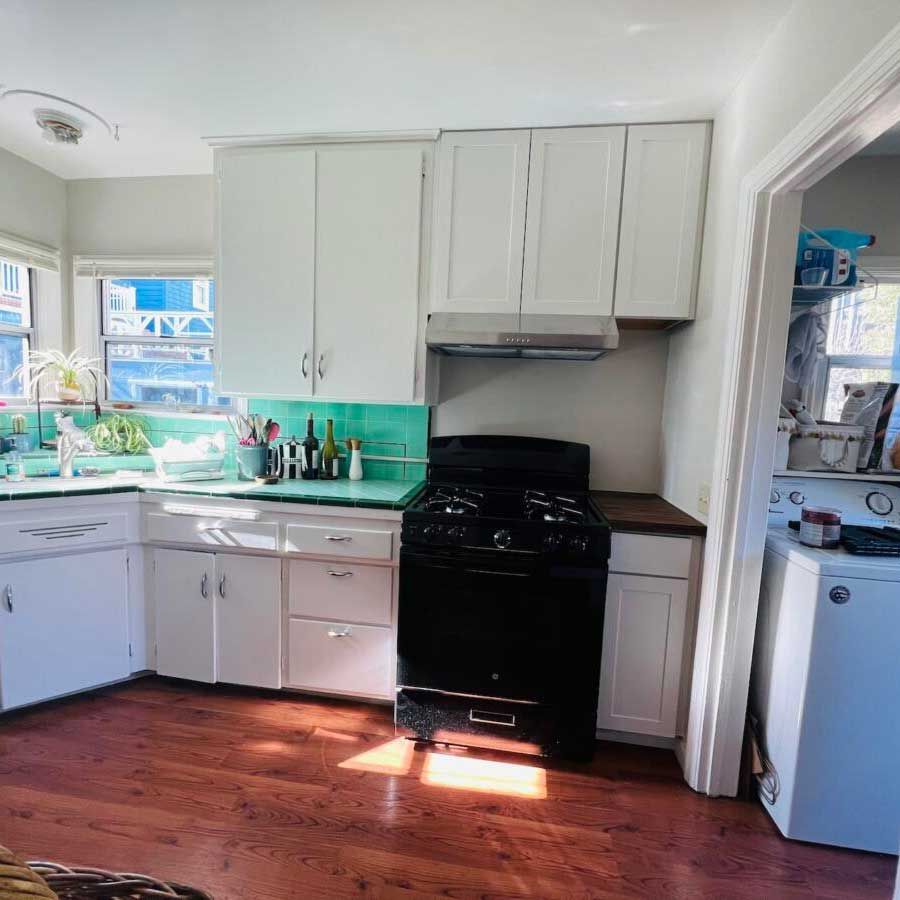 Kitchen with Black Stove — Carmel Valley, CA — Luxury Custom Painting