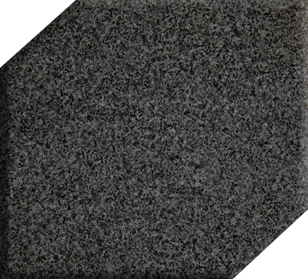 Black glittery hexagonal tile with clipped corners on a white background