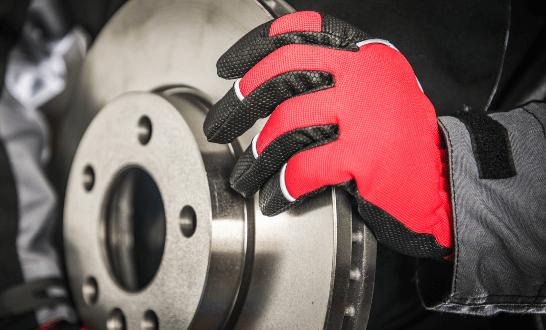 Brake repair rotor being replaced