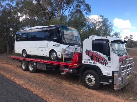 Truck Towing red car — Towing in Dubbo, NSW Truck Towing red car — Towing in Dubbo, NSW