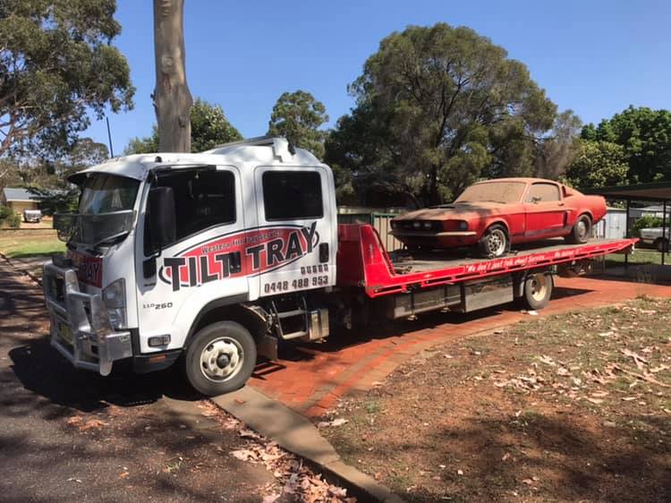 Truck Towing a Red Car — Towing in Walgett, NSW