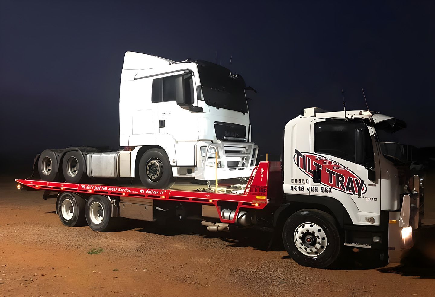 Semi-Truck Loaded On A Tilt Tray Tow Truck