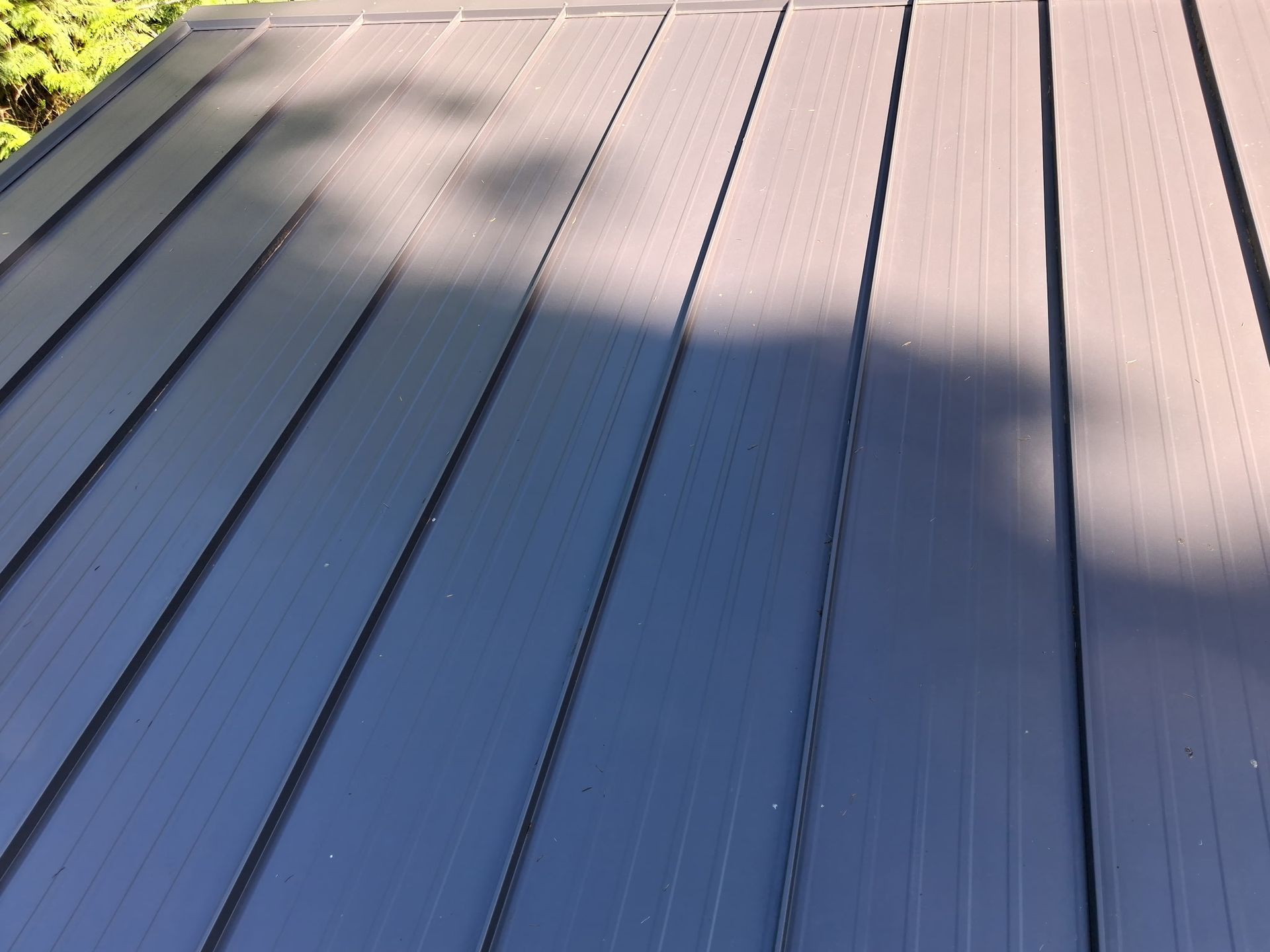 Gray wooden deck boards in sunlight and shadow