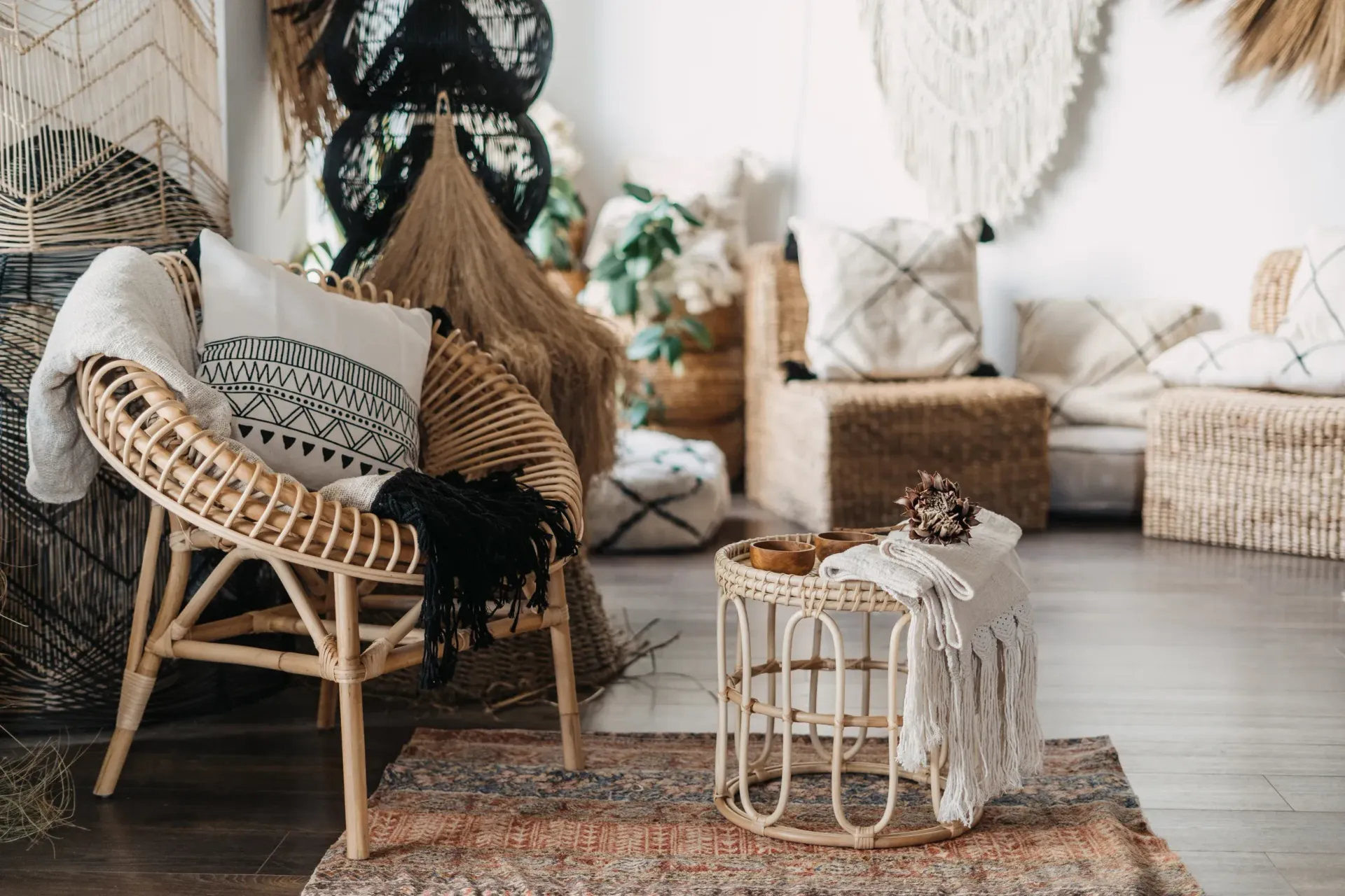 There is a wicker chair in the middle of the room.