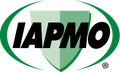 The IAPMO logo: a green shield inside an oval with the black letters 