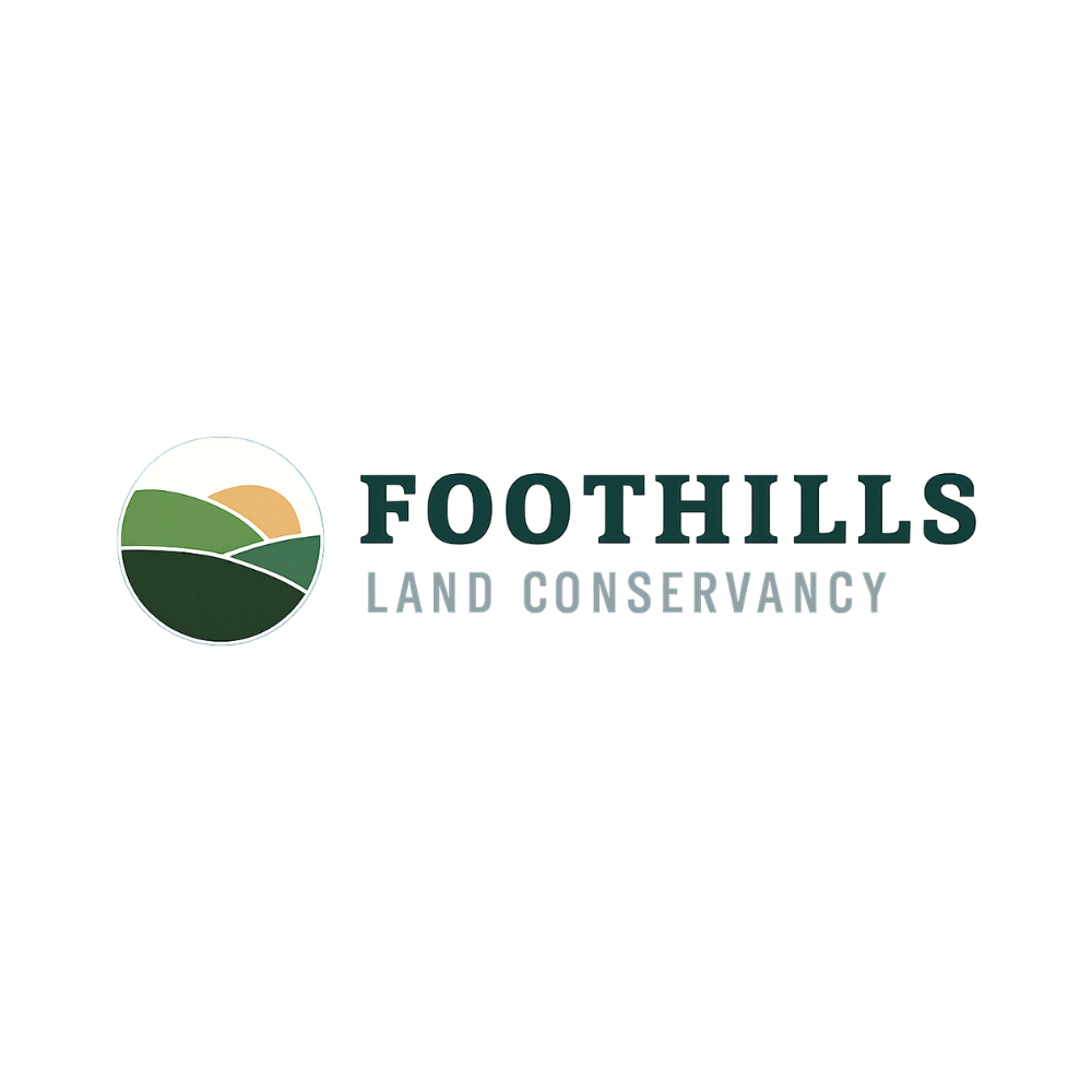 Foothills Land Conservancy logo with a circular image of hills, a setting sun, and text.