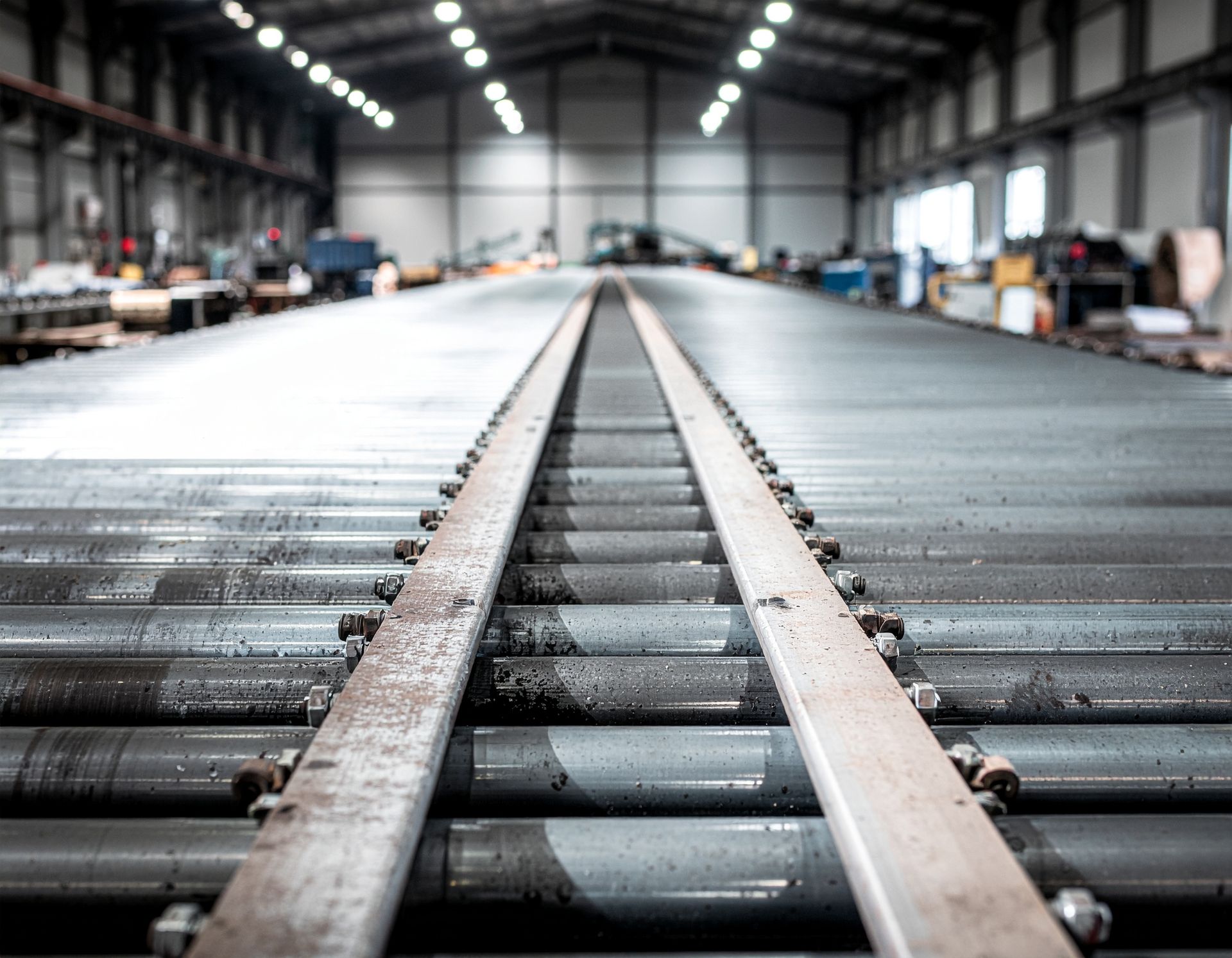 Conveyor belt in a factory, stretching into the distance.
