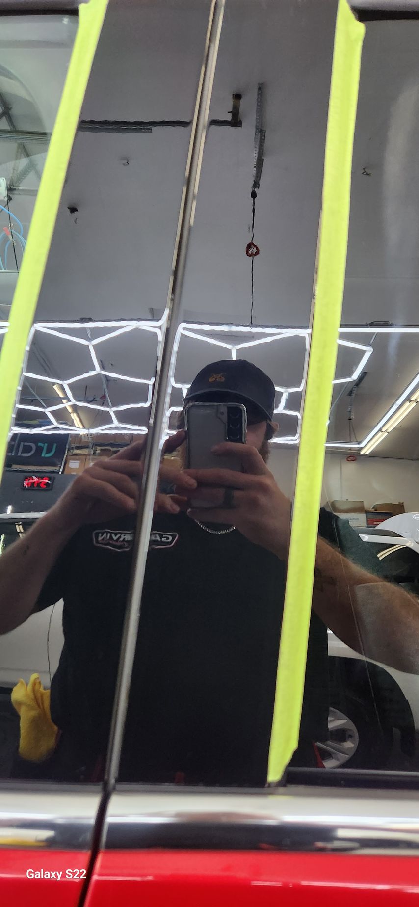 A man is taking a picture of himself in a mirror.