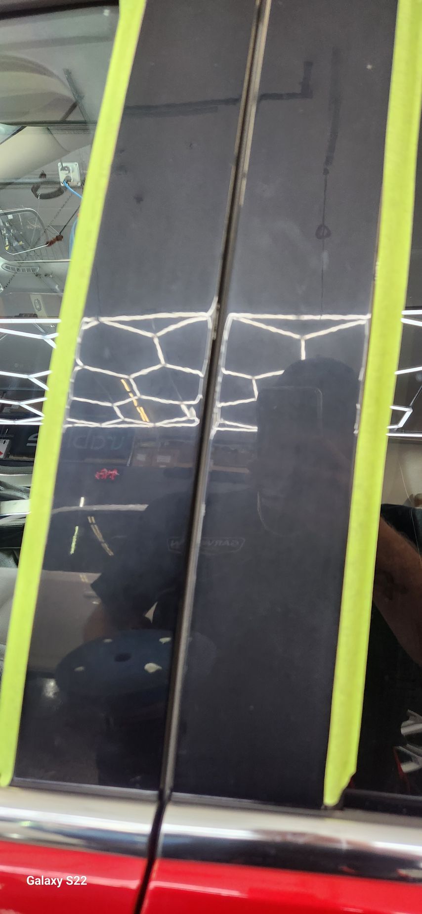 A close up of a car with yellow tape on it