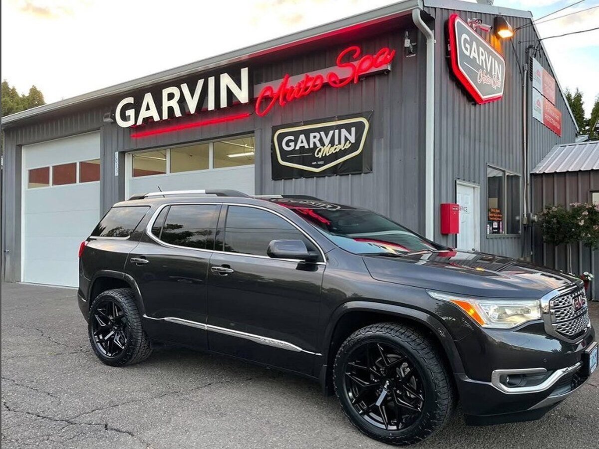 Dark SUV parked in front of