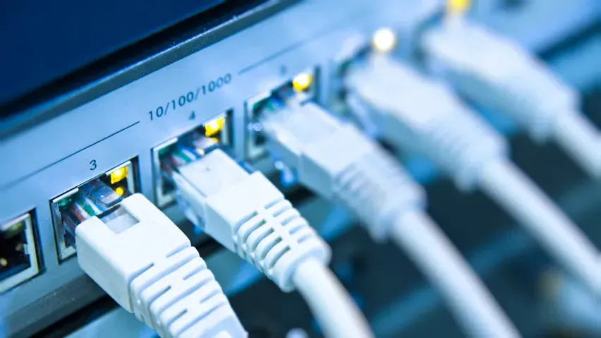 Network switch with Ethernet cables plugged in.