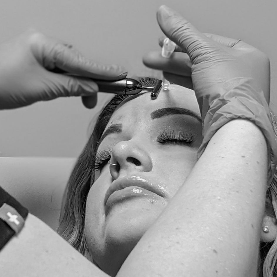 Woman receiving injectable aesthetic treatments at Skin & Soul Med Spa in Seabrook Texas.