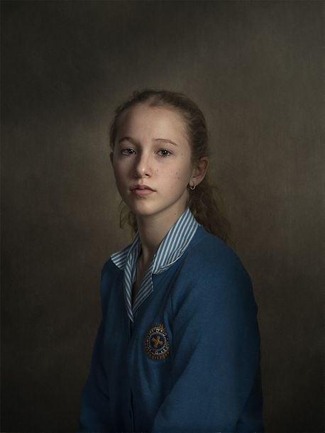 A studio fine art portrait of a person using intricate lighting patterns to create a timeless feel.