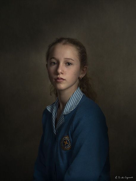 A studio fine art portrait of a person using intricate lighting patterns to create a timeless feel.