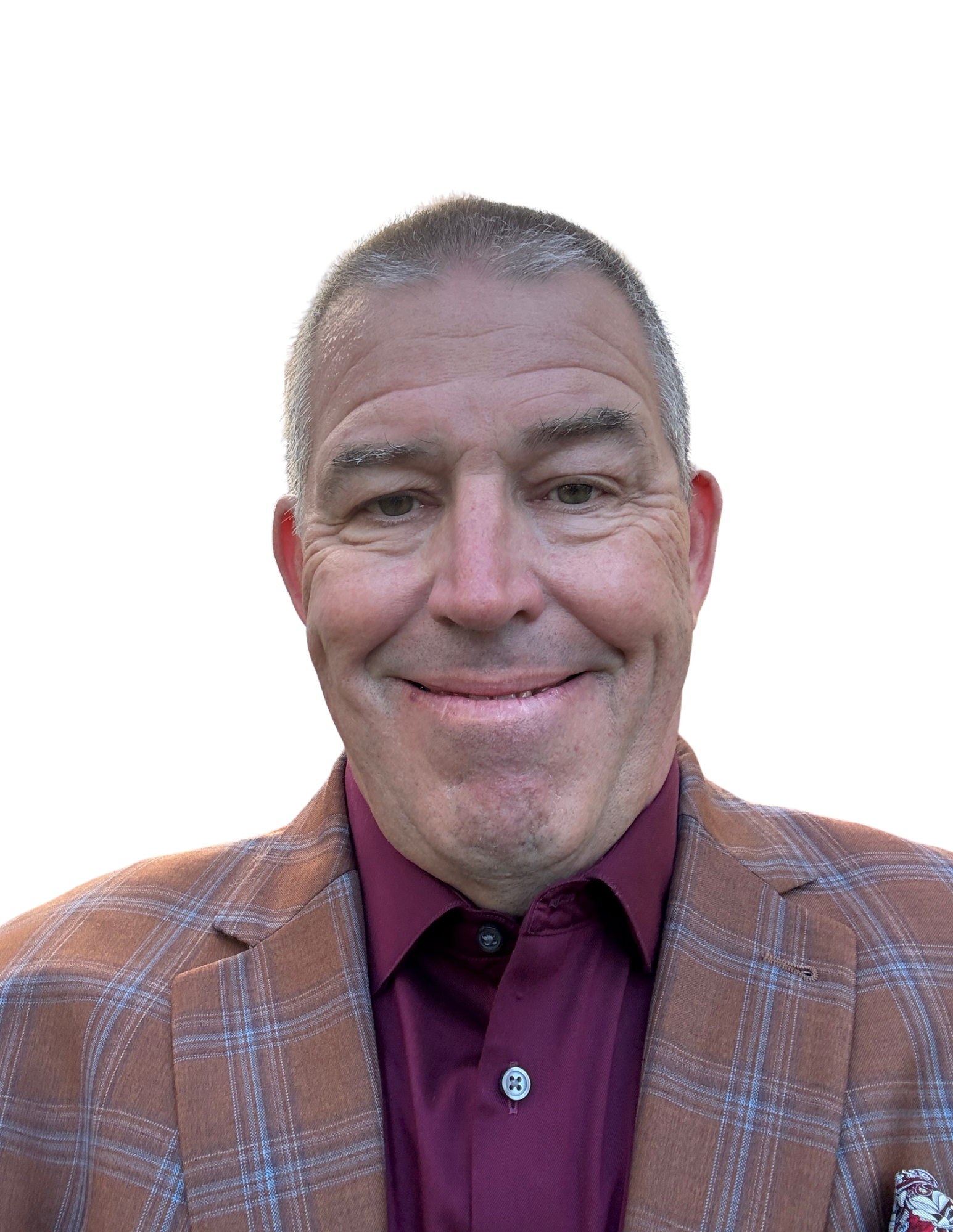 Smiling man in a plaid blazer and maroon shirt against a white background