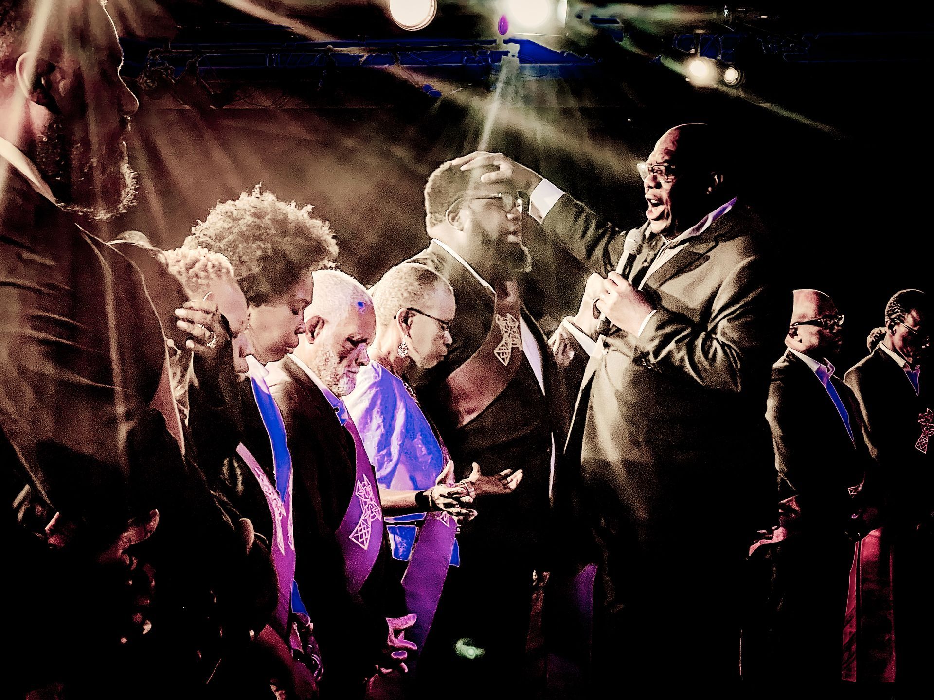 People praying together at a ministry center in Queens, NY.
